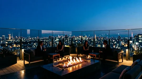 Elegant rooftop lounge setting with fire pit and panoramic city view at twilight