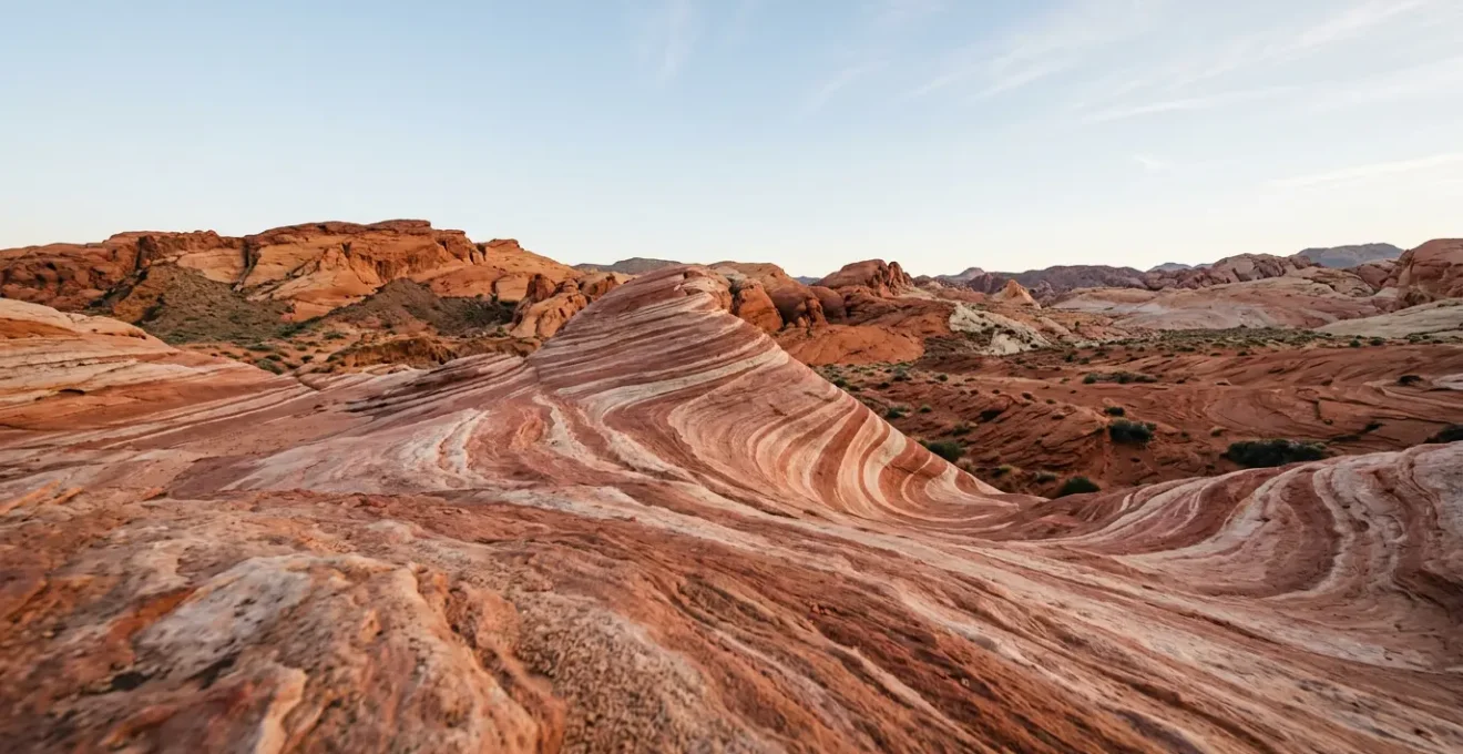 Fire Wave formation with flowing red, pink, and white sandstone stripes in Valley of Fire State Park, Nevada