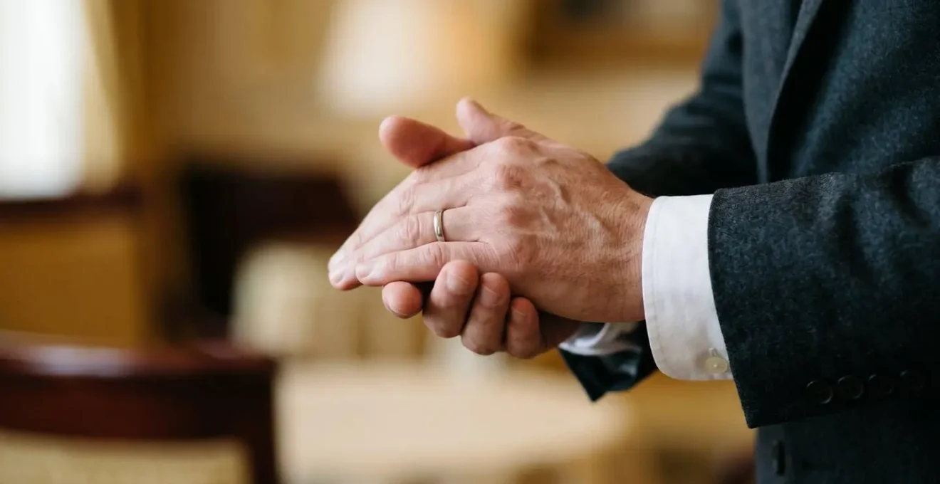 Close-up of a concierge's hands graciously receiving a gratuity in a discreet gesture, symbolizing appreciation for exceptional service