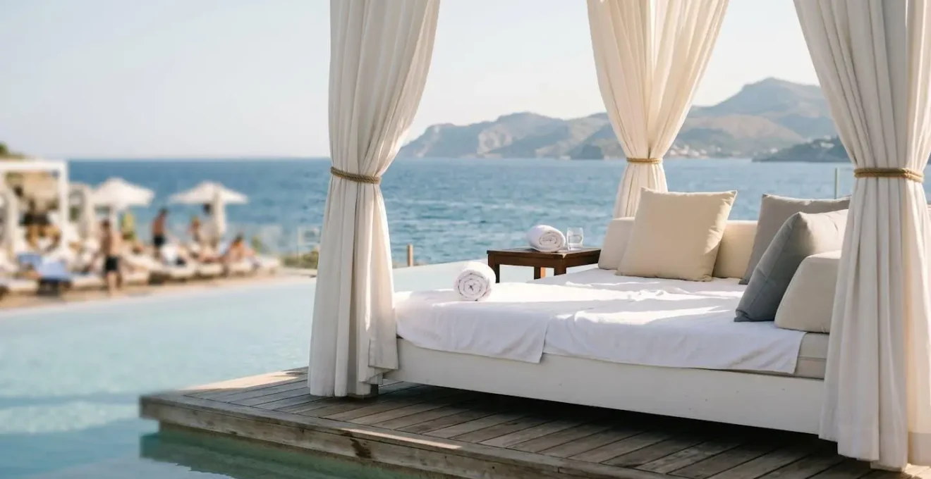 Luxury resort daybed positioned at pool periphery offering privacy and ocean view perspective away from crowds