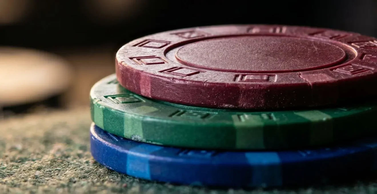 Extreme close-up macro photograph of casino chips showing detailed texture and color contrast